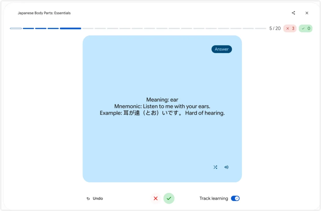 AI flashcard showing Japanese body part meaning, mnemonic, and example sentence